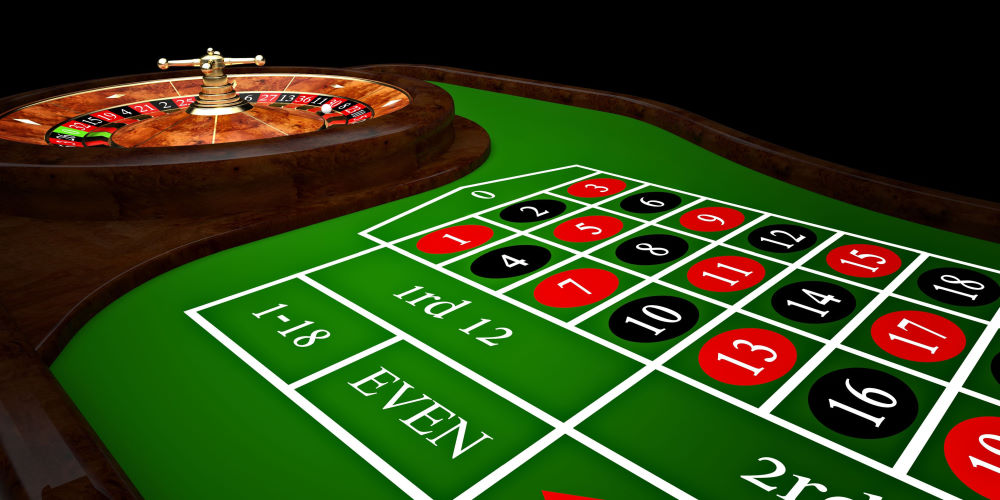 ruleta de casino clásica y mesa verde